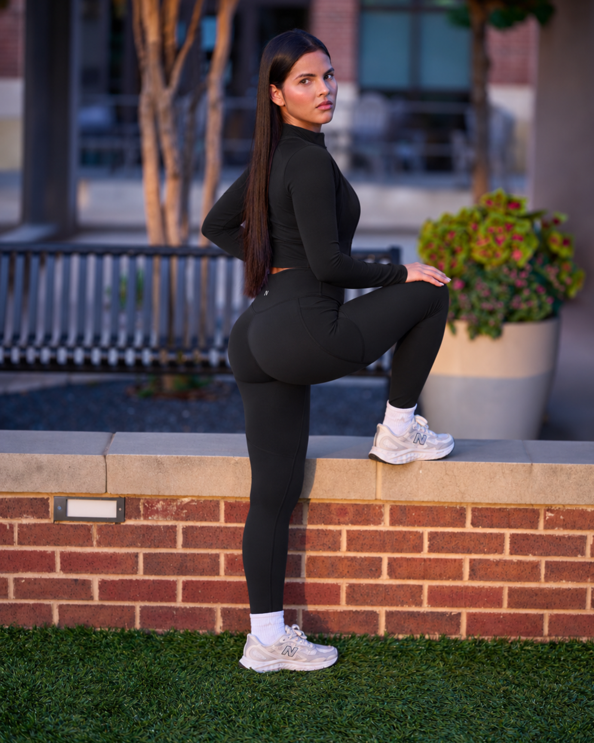Halo Set in Black, outdoor side view with one foot on a ledge
