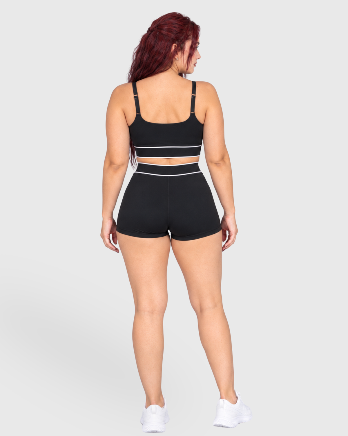 Tempo Set in Black, full-body back view of strappy sports bra and shorts
