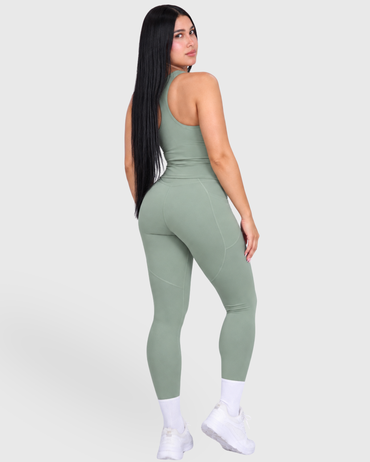 Poise Set in Green, full-body back view of tank top and leggings