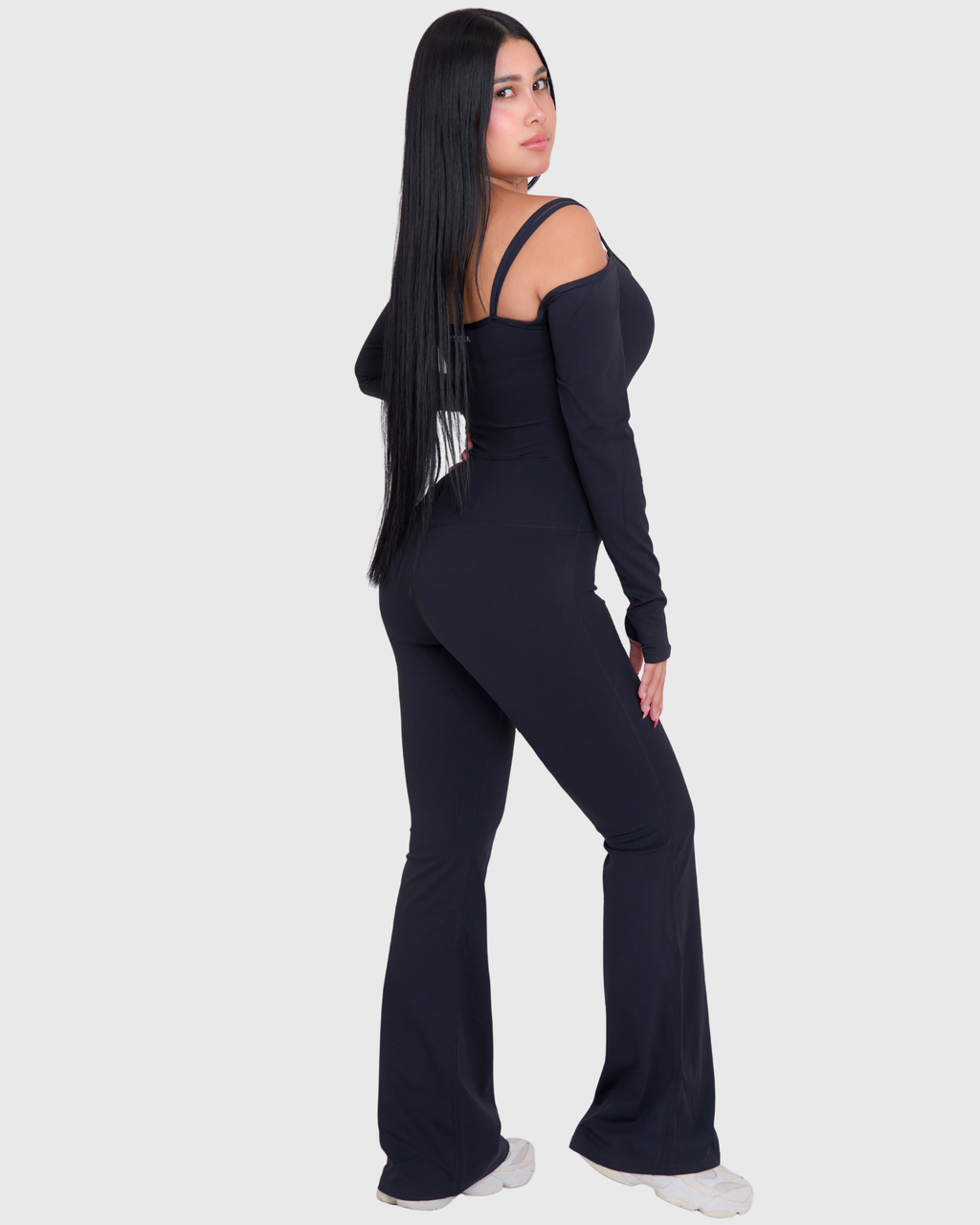 Off-Shoulder Flare Jumpsuit in Black, full-body back view of flared fit
