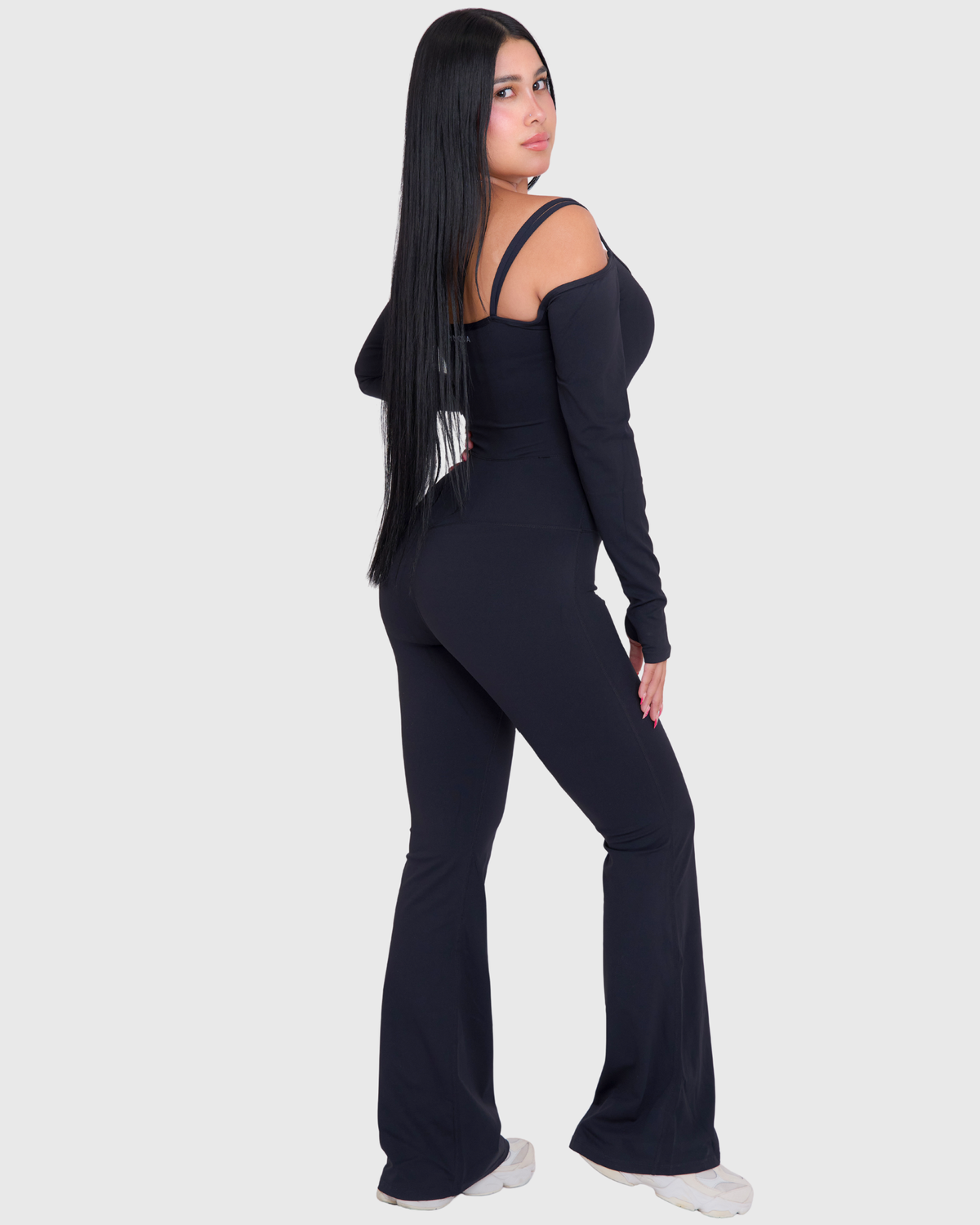 Off-Shoulder Flare Jumpsuit in Black, full-body back view of flared fit