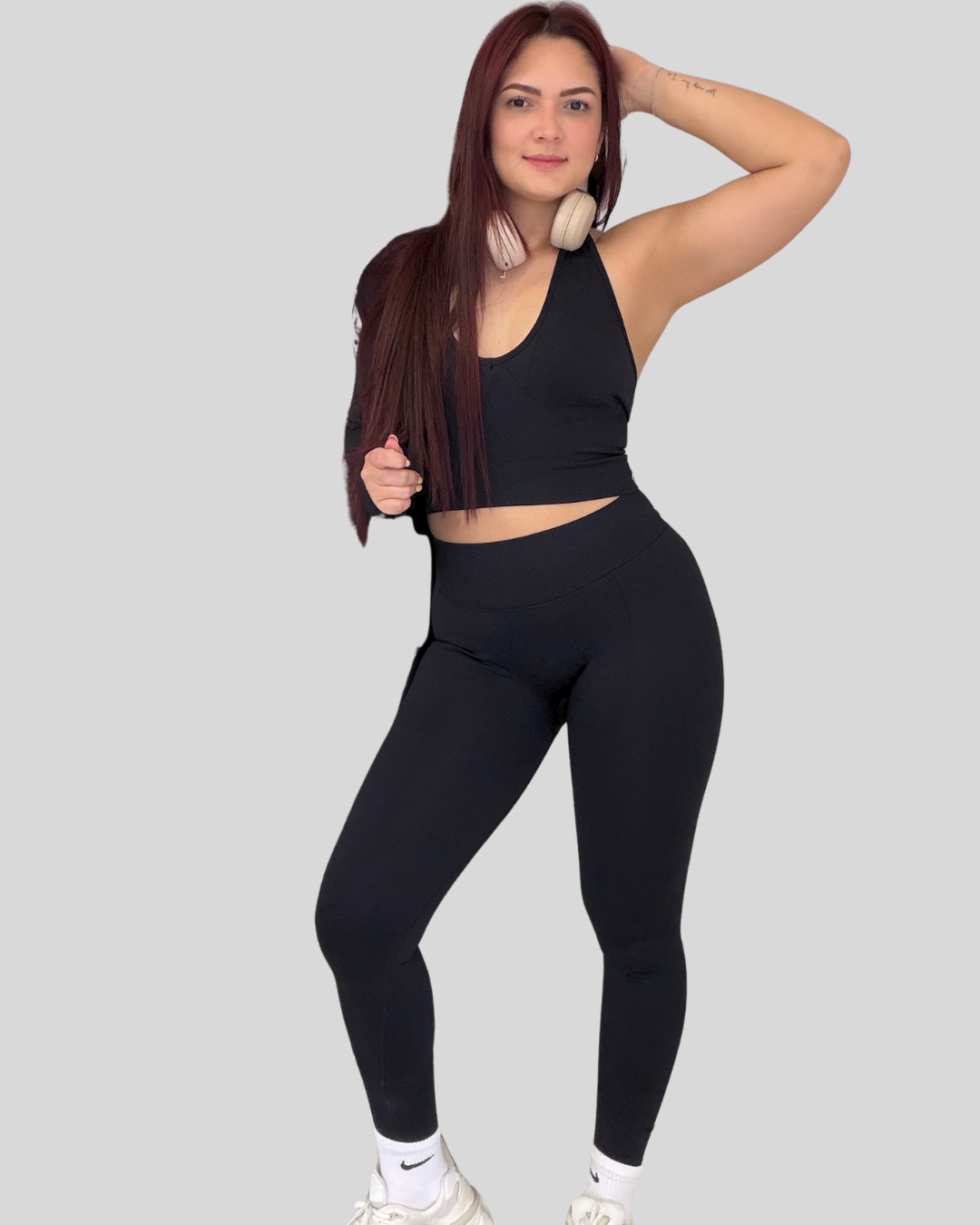 Halo Set in Black, front view of sports bra and leggings in studio