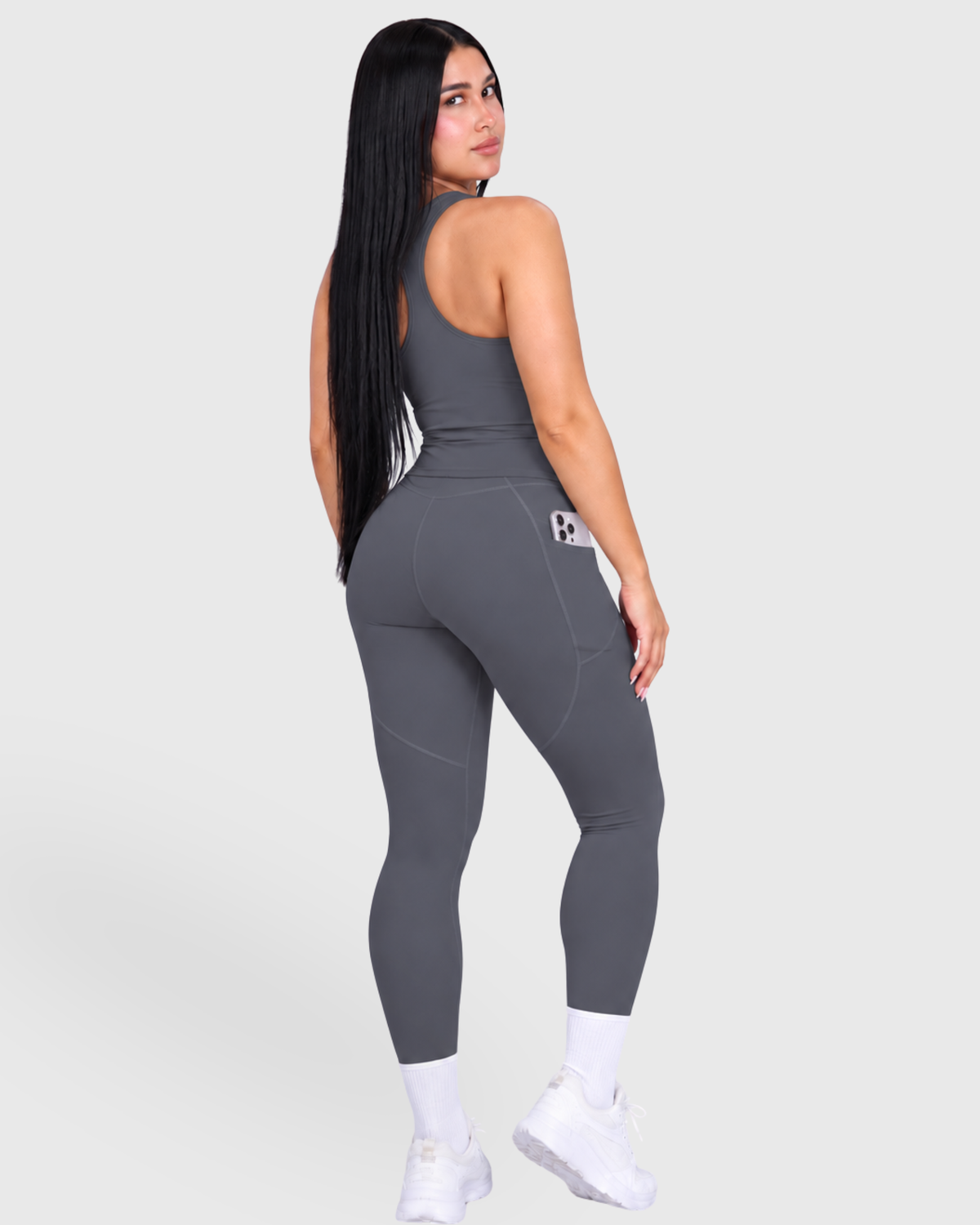 Poise Set in Dark Grey, full-body back view showing leggings side pocket